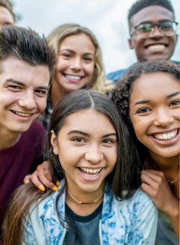 photo of teens smiling at the camera