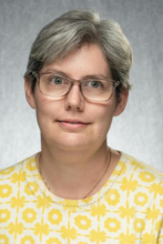 picture of Molly, short hair and yellow shirtl