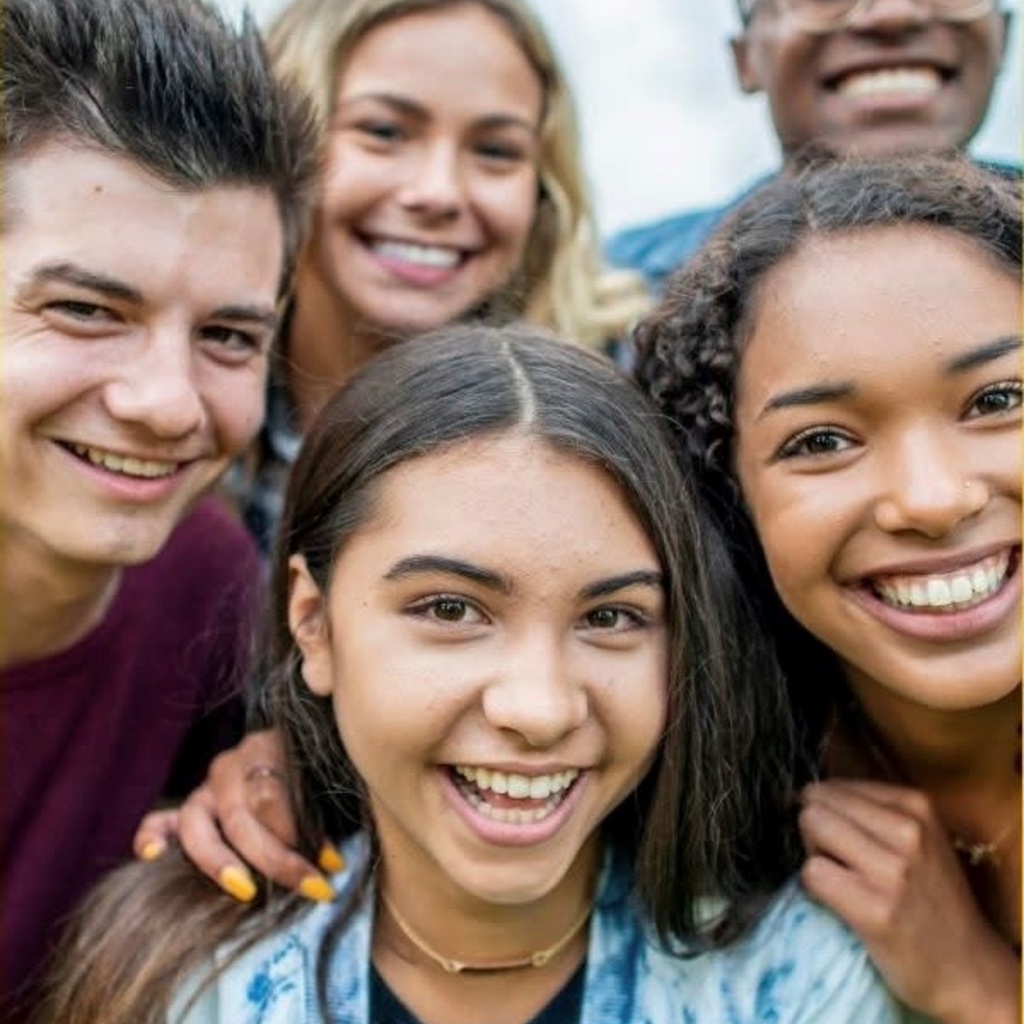 photo of teens smiling at the camera