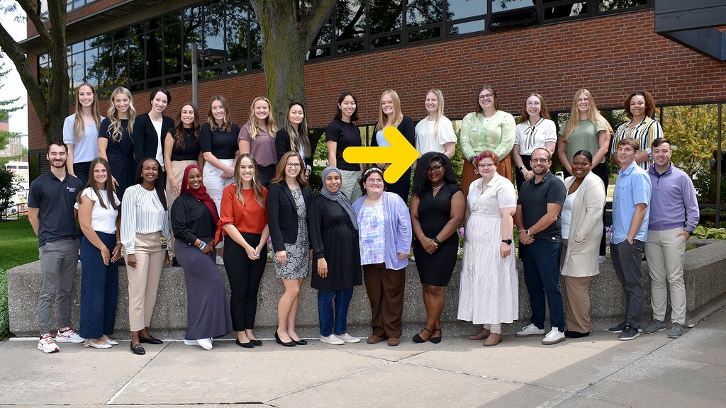 LEND trainees group photo with arrow to play video
